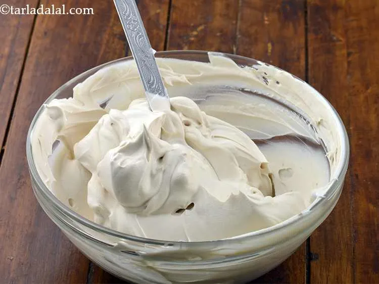 Step 6 – Add this to the <a href="/Whipped-Cream-(-Eggless-Desserts-Recipe)-1106r">beaten whipped cream </a>and mix well. Keep aside.