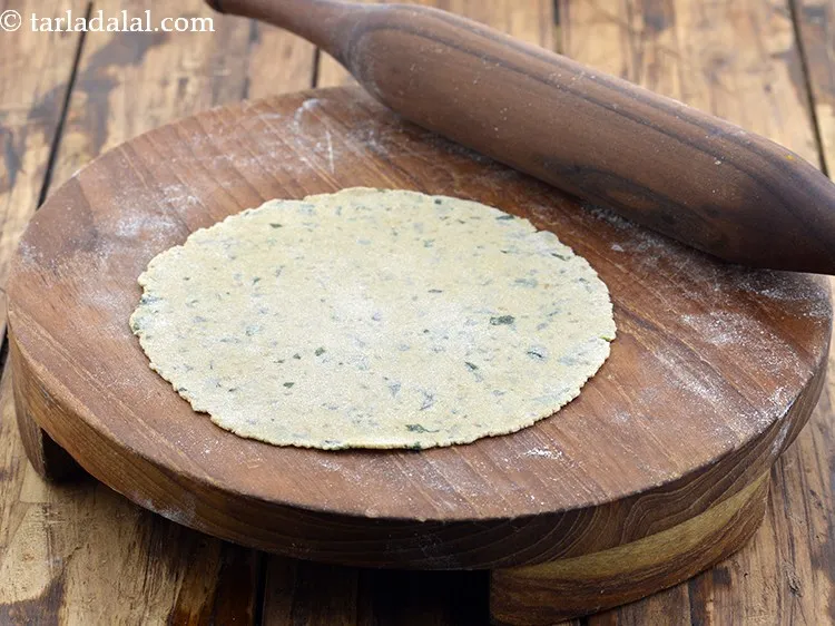 Step 19 – Roll out a portion of dough into a 150 mm (6&rdquo;) diameter circle using a …