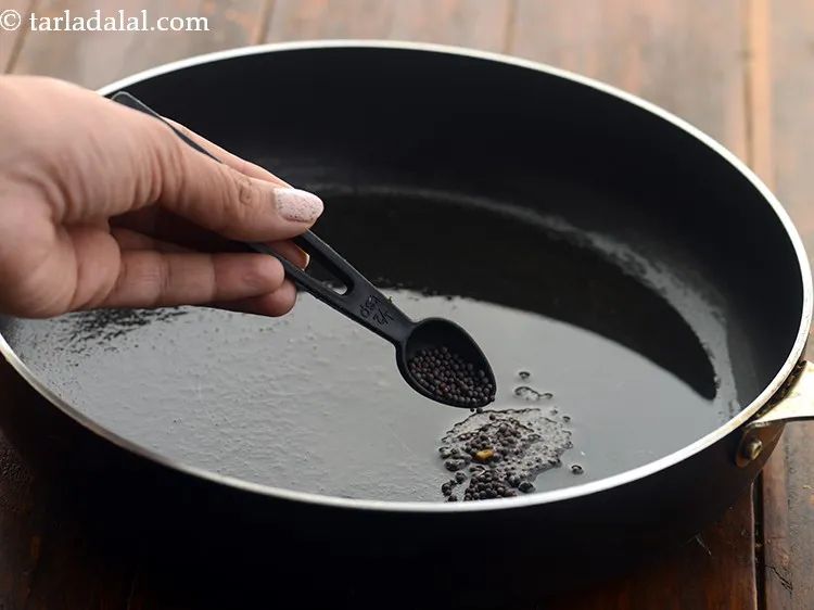 Step 25 – Add 1 tsp&nbsp;<a href="https://www.tarladalal.com/glossary-mustard-seeds-sarson-rai-sarson-ke-beej-525i">mustard seeds (rai / sarson)</a>.