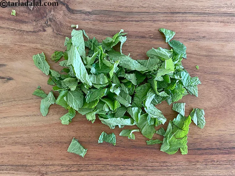 Step 12 – Put the washed leaves on a chopping board and chop them using a sharp knife …