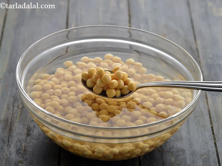 Step 5 – For making the <strong>ragda</strong>, put the white peas in enough water, cover with a lid …