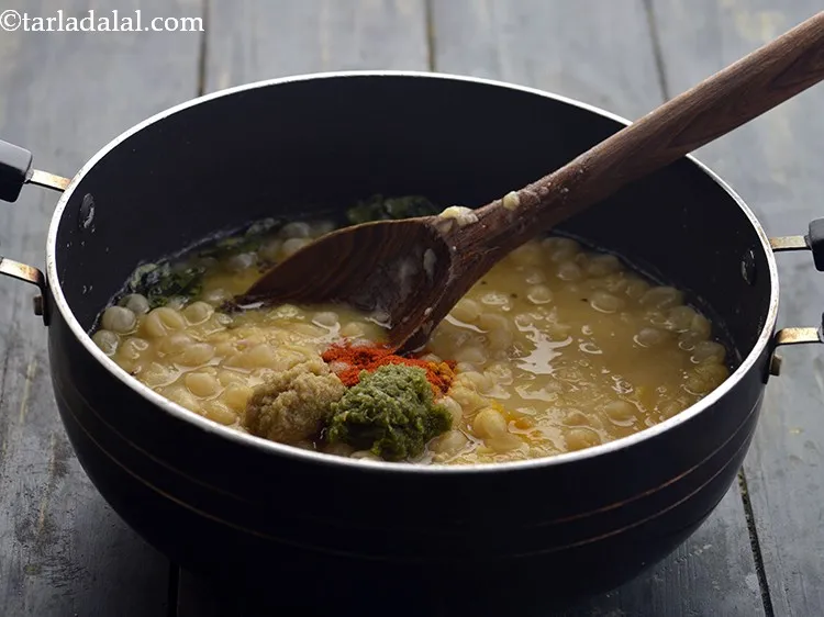 Step 18 – Add the <a href="https://www.tarladalal.com/Ginger-Green-Chilli-Paste-33529r" target="_blank">ginger-green chilli paste</a>. My freezer is always stocked with this.