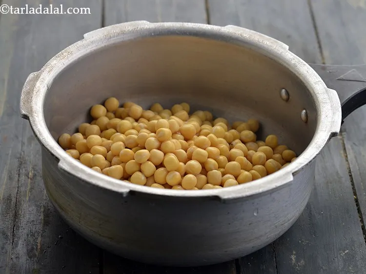 Step 7 – Put the soaked and drained peas in a pressure cooker.