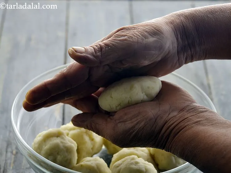 Step 37 – For making the stuffed pattice, take one portion of the potato dough.
