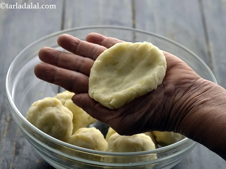 Step 38 – Carefully flatten it between the palms of both your hands, making sure it does not …