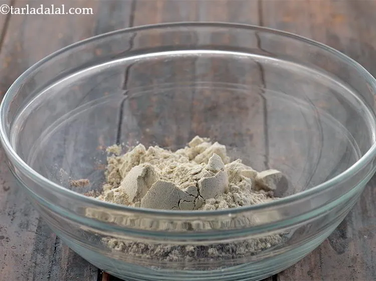 Step 12 – Add 1/4 cup&nbsp;<a href="https://www.tarladalal.com/glossary-whole-wheat-flour-gehun-ka-atta-gehun-ka-aata-429i">whole wheat flour (gehun ka atta)</a>.