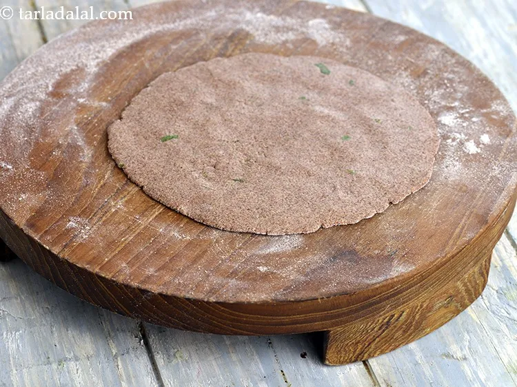 Step 24 – When the non-stick tava is hot place the bhakri gently over it. If the pan …