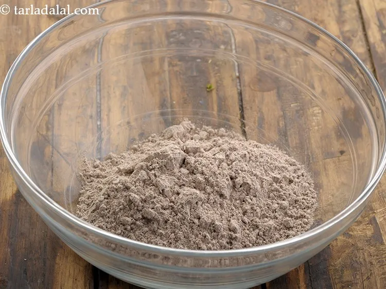 Step 2 – To make dough for <strong>Stuffed Nachni Roti</strong>, take a deep bowl. Into it add <meta …