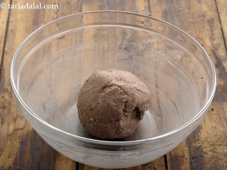 Step 10 – Gradually add water and knead into a soft, smooth dough.