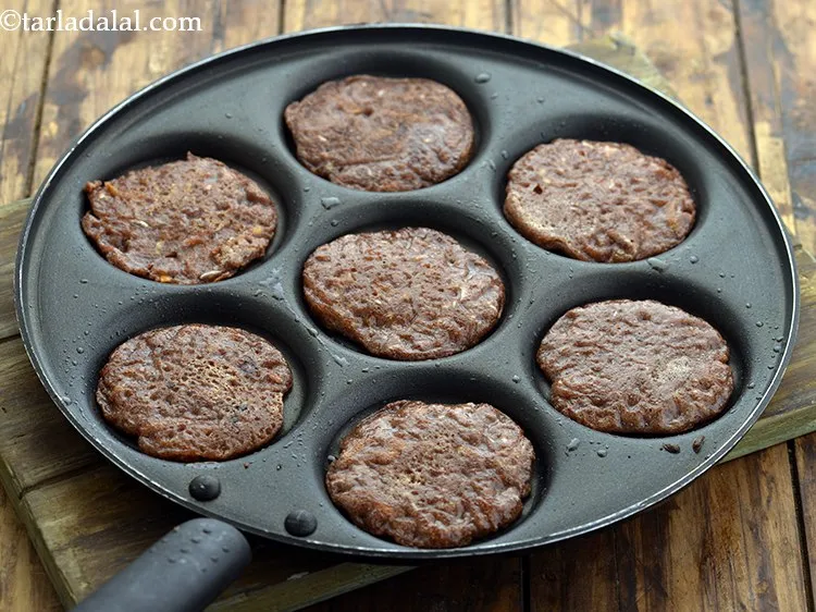 Step 24 – Cook all the&nbsp;<strong>Mini Ragi Uttapa for Kids and Toddlers</strong>, till they turn golden brown in …