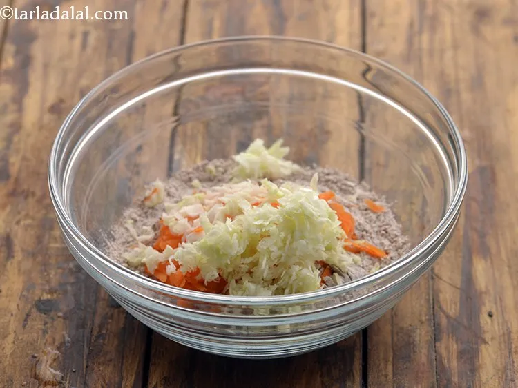 Step 14 – Add some grated cabbage to make the batter of <strong>Nachni Uttapam for Babies </strong>also. This …