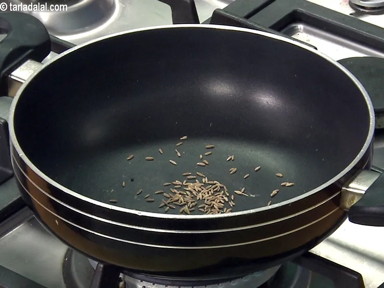 Step 41 – Heat a deep non-stick pan on a medium flame and when hot, add the cumin …
