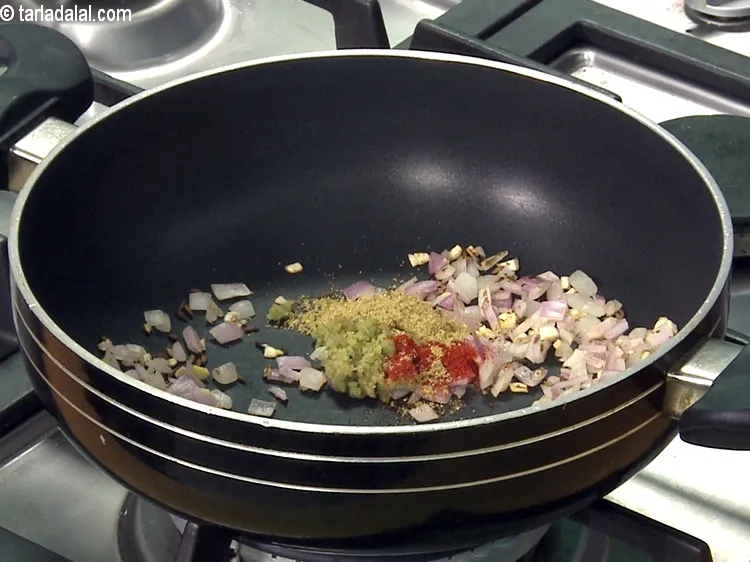 Step 43 – Add the ginger-green chilli paste, chilli powder, coriander-cumin seeds powder.