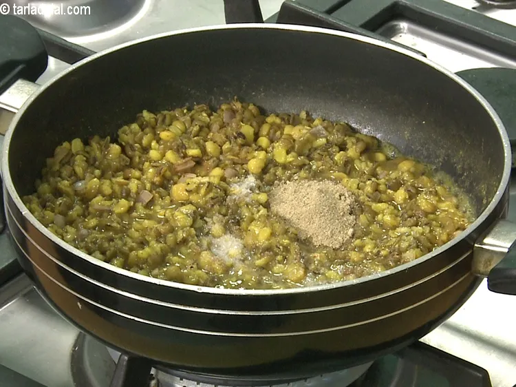 Step 46 – <meta charset="UTF-8" /> Add a little salt, dry mango powder and &frac12; cup of water.