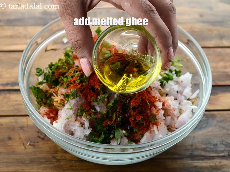 Step 12 – Add 1 tbsp&nbsp;melted&nbsp;<a href="https://www.tarladalal.com/glossary-ghee-245i">ghee</a>. This helps to coat the chilli powder well.&nbsp;