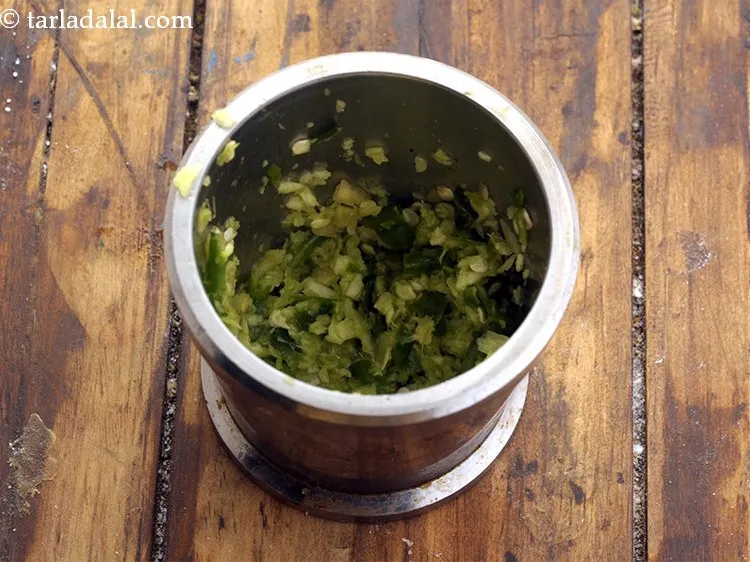 Step 13 – <p>Pound to a coarse paste and keep aside. Freshly pounded ginger, garlic and green chilli …
