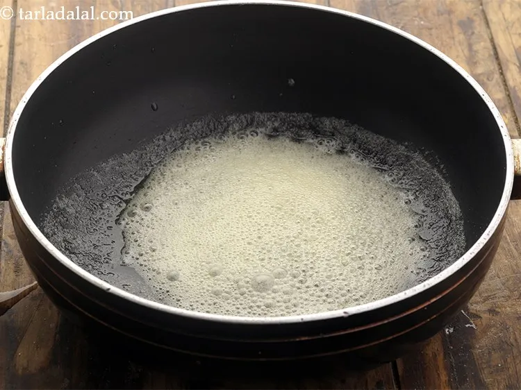 Step 14 – <p>Further, heat oil and butter in a deep non-stick pan.</p>
