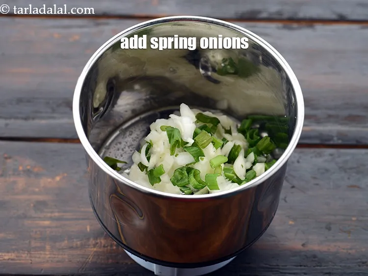 Step 10 – Add 1/4 cup&nbsp;<a href="https://www.tarladalal.com/glossary-chopped-spring-onions-1575i">chopped spring onions</a>. This is the main ingredient of this spread.&nbsp;