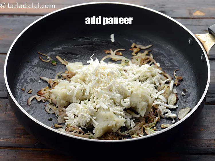 Step 31 – Add 1/3 cup&nbsp;<a href="https://www.tarladalal.com/glossary-grated-panee-1003i">grated paneer (cottage cheese)</a>. Try and use fresh and soft paneer.&nbsp;