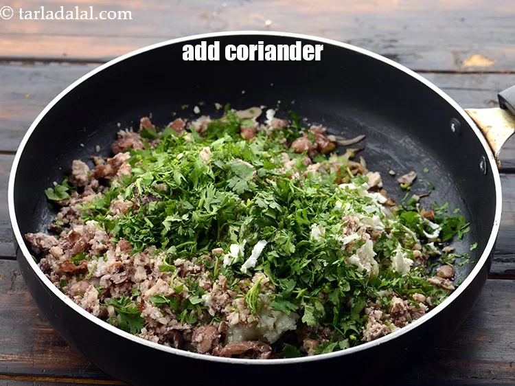 Step 33 – Add 1/3 cup&nbsp;<a href="https://www.tarladalal.com/glossary-chopped-coriander-783i">chopped coriander (dhania)</a>.