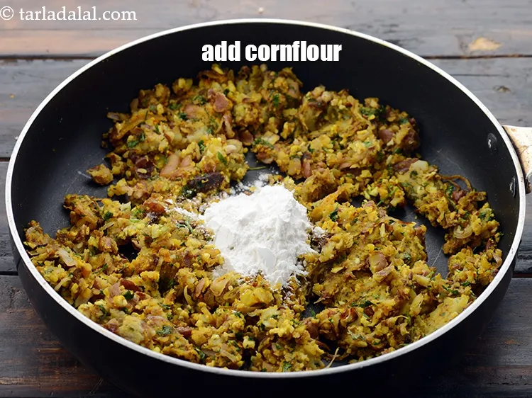 Step 39 – Add 2 tbsp&nbsp;<a href="https://www.tarladalal.com/glossary-cornflour-cornstarch-maize-starch-corn-flour-112i">cornflour</a>. This gives little binding.&nbsp;