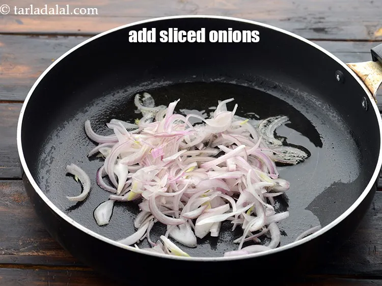 Step 25 – Add 3/4 cup&nbsp;<a href="https://www.tarladalal.com/glossary-sliced-onions-745i">sliced onions</a>.