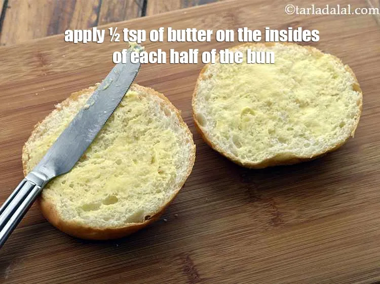 Step 62 – Apply &frac12; tsp of butter on the insides of each half of the burger bun.