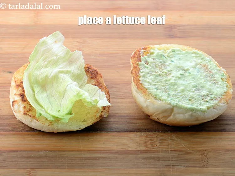 Step 67 – Place a lettuce leaf on the bun.