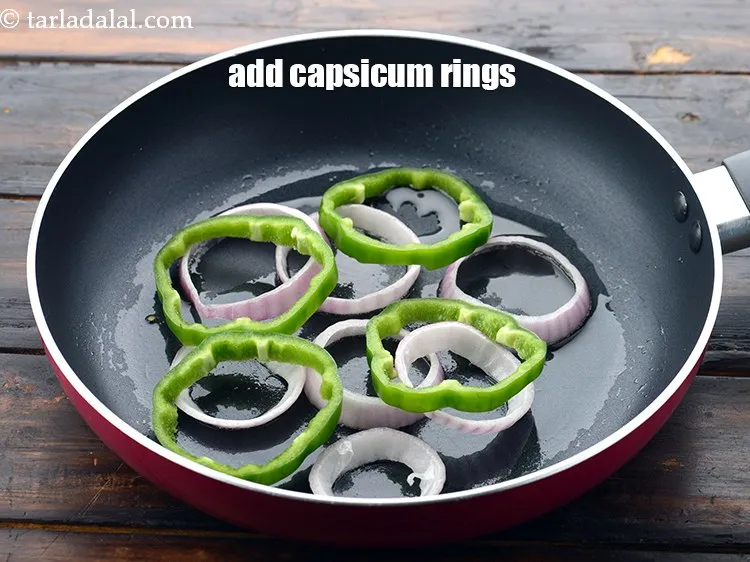 Step 52 – Add 4&nbsp;<a href="https://www.tarladalal.com/glossary-capsicum-rings-167i">capsicum rings</a>.&nbsp;