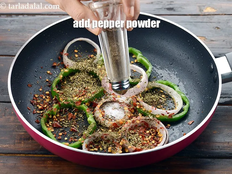 Step 57 – Add the <a href="https://www.tarladalal.com/glossary-freshly-ground-black-pepper-kalimirch-powder-kali-mirch-ka-powder-567i">freshly ground black pepper (kalimirch)</a>&nbsp;to taste.