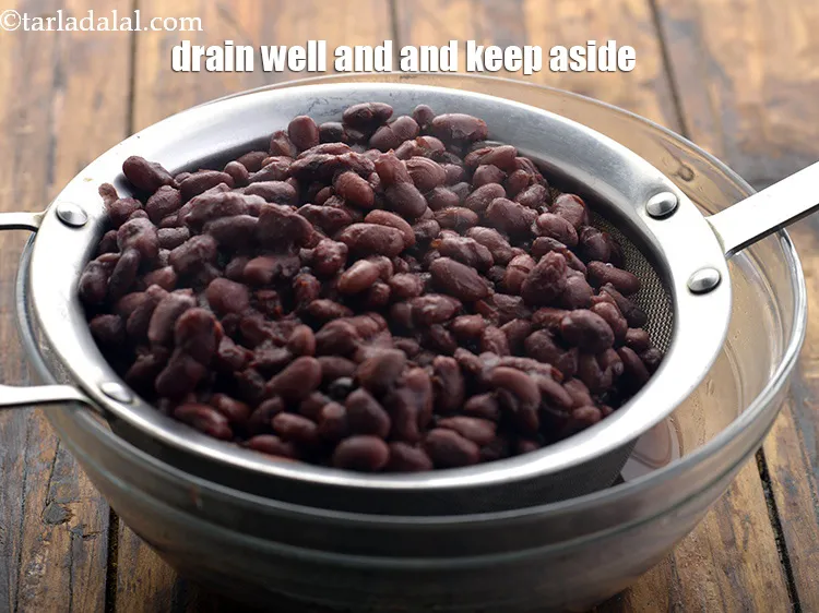 Step 10 – <meta charset="UTF-8" />Strain the rajma and keep aside. You may reserve and use this water …