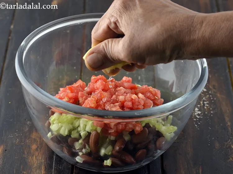 Step 8 – Add lemon juice to the <strong>Rajma Salad</strong>.