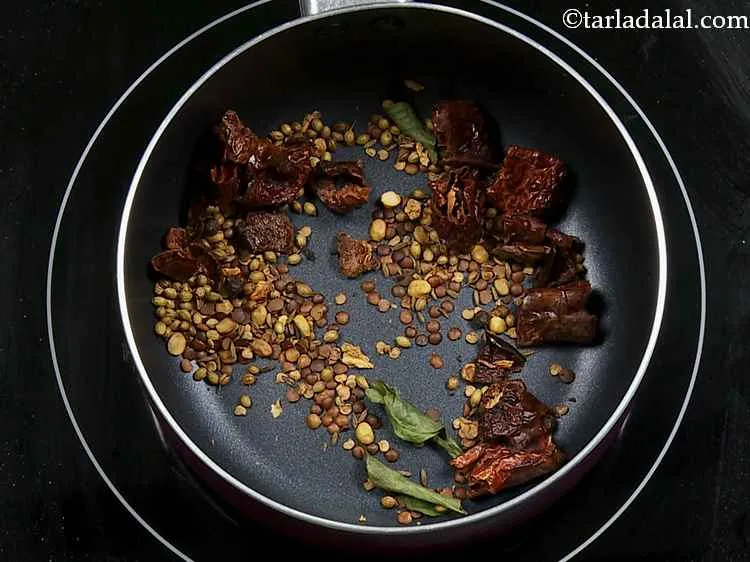 Step 8 – Dry roast the spices and the dals together for about 5 to 7 minutes on …