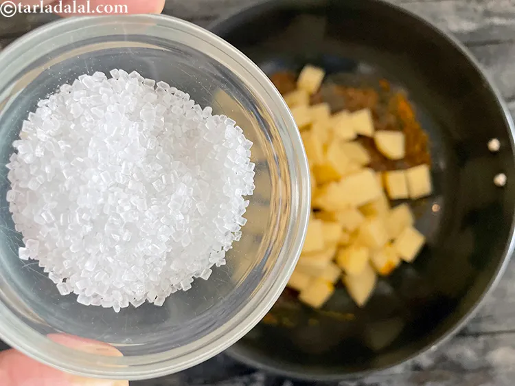 स्टेप 18 – २ टेबल-स्पून <a href=""https://www.tarladalal.com/glossary-sugar-chini-shakkar-hindi-278i"">शक्कर</a> डालें। गुजराती शाक थोड़ा मीठा होता …