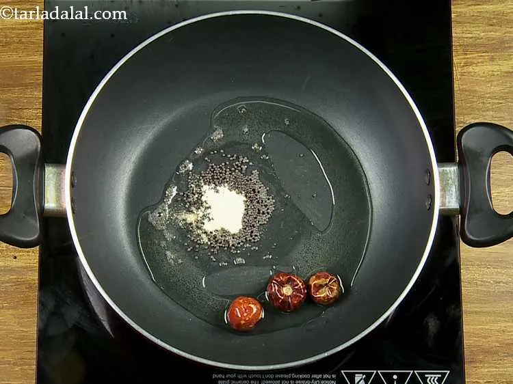 Step 25 – Add the red chillies. We are making use of round red chillies (boriya marcha) which …