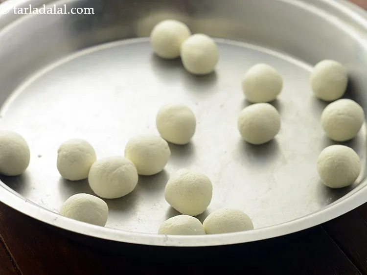 Step 24 – Divide the chenna dough into 16 equal portions. Roll each portion into small balls between …