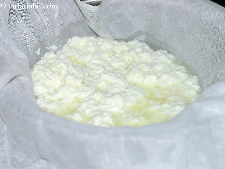 Step 6 – Place a clean muslin cloth over a strainer and transfer the chenna over it to …