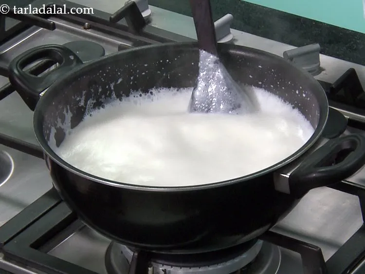Step 30 – Boil the milk in a deep non-stick pan on a high flame, while stirring twice …
