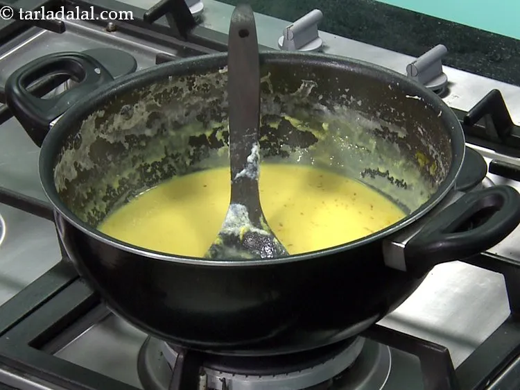 Step 5 – Switch off the flame, add the saffron-milk mixture and cardamom powder and mix well.