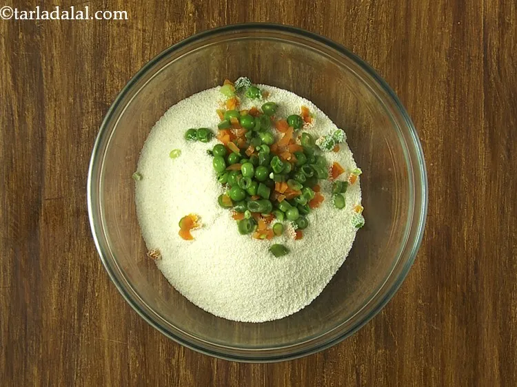 Step 8 – To this, add the boiled mixed vegetable viz. carrots, French beans and green peas. Also, …