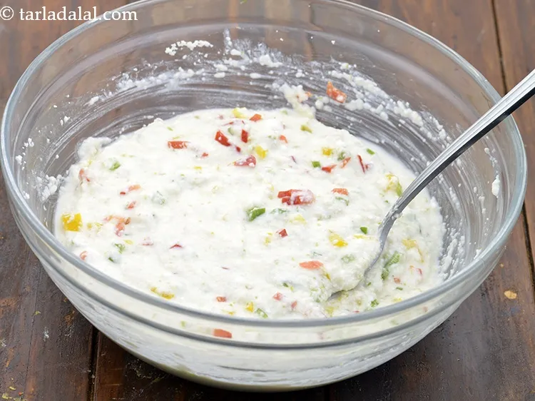 Step 12 – Mix gently. Mixing it vigorously will reduce its effect and the dhokla may not turn …