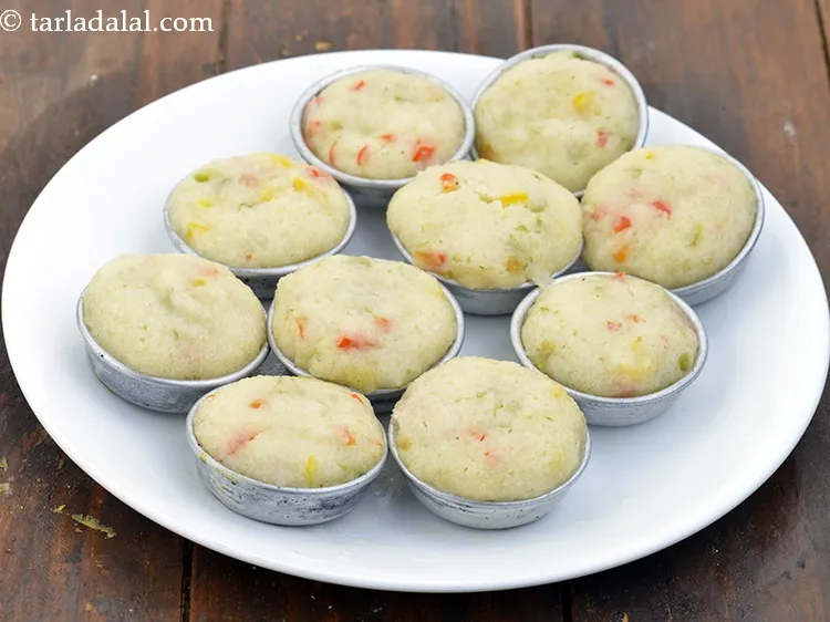 Step 14 – Pour the batter into 12 greased dhokla moulds and steam in a steamer for 10 …