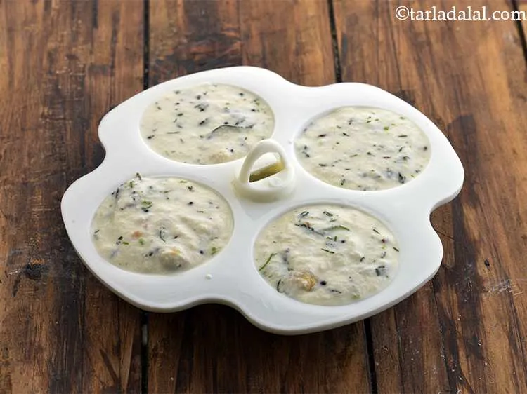 Step 23 – Pour little &nbsp;<strong>Rava Idli </strong>&nbsp;batter into each greased cavity of the idli moulds. We have …