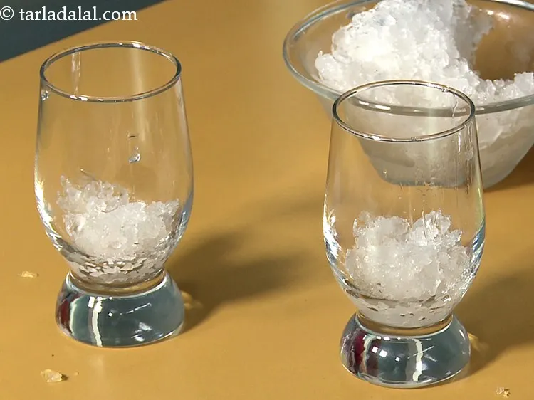 Step 18 – For serving, place 2 tbsp of <a href="https://www.tarladalal.com/glossary-crushed-ice-1944i">crushed ice</a> in 4 individual glasses.