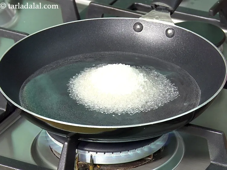 Step 7 – Add 1/3 cup&nbsp;<a href="https://www.tarladalal.com/glossary-sugar-chini-shakkar-278i">sugar</a>.