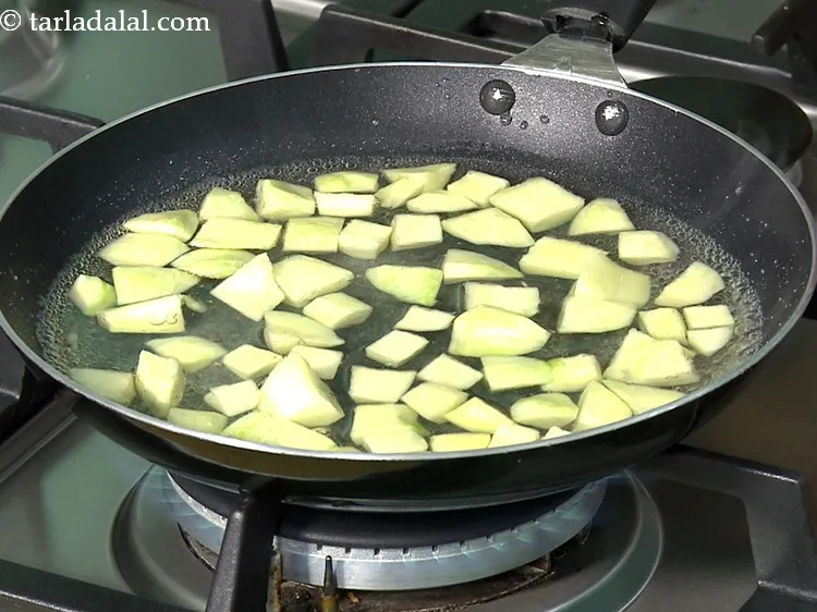 Step 9 – Add 1 cup&nbsp;peeled&nbsp;<a href="https://www.tarladalal.com/glossary-raw-mango-cubes-2034i">raw mango cubes</a>.