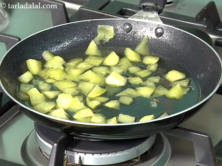 Step 10 – Cook on a medium flame for another 3 to 4 minutes, till the raw mangoes …