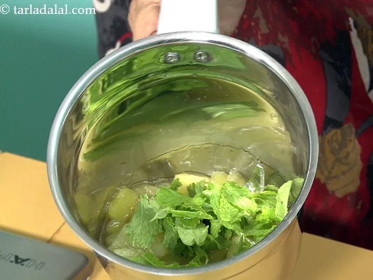 Step 12 – Add 1/4 cup&nbsp;<a href="https://www.tarladalal.com/glossary-mint-leaves-pudina-phudina-521i">mint leaves (phudina)</a>.