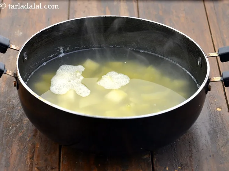 Step 12 – Cook the raw mangoes on a medium flame for 3 to 4 minutes, while stirring …