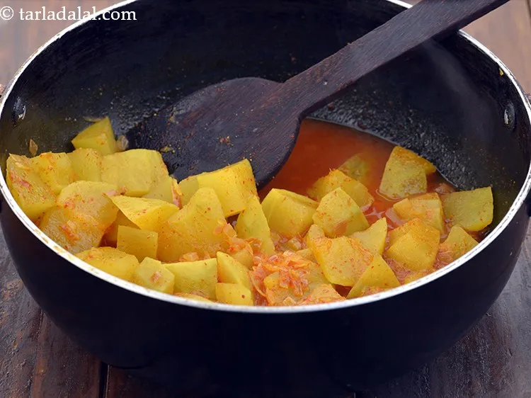 Step 22 – Mix well and cook on a medium flame for 4 minutes, while stirring occasionally.